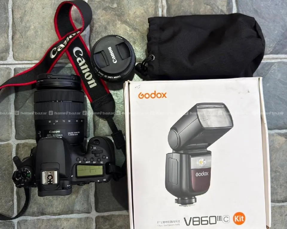 cannon eos 90D with 50mm lens and godox flash light 2