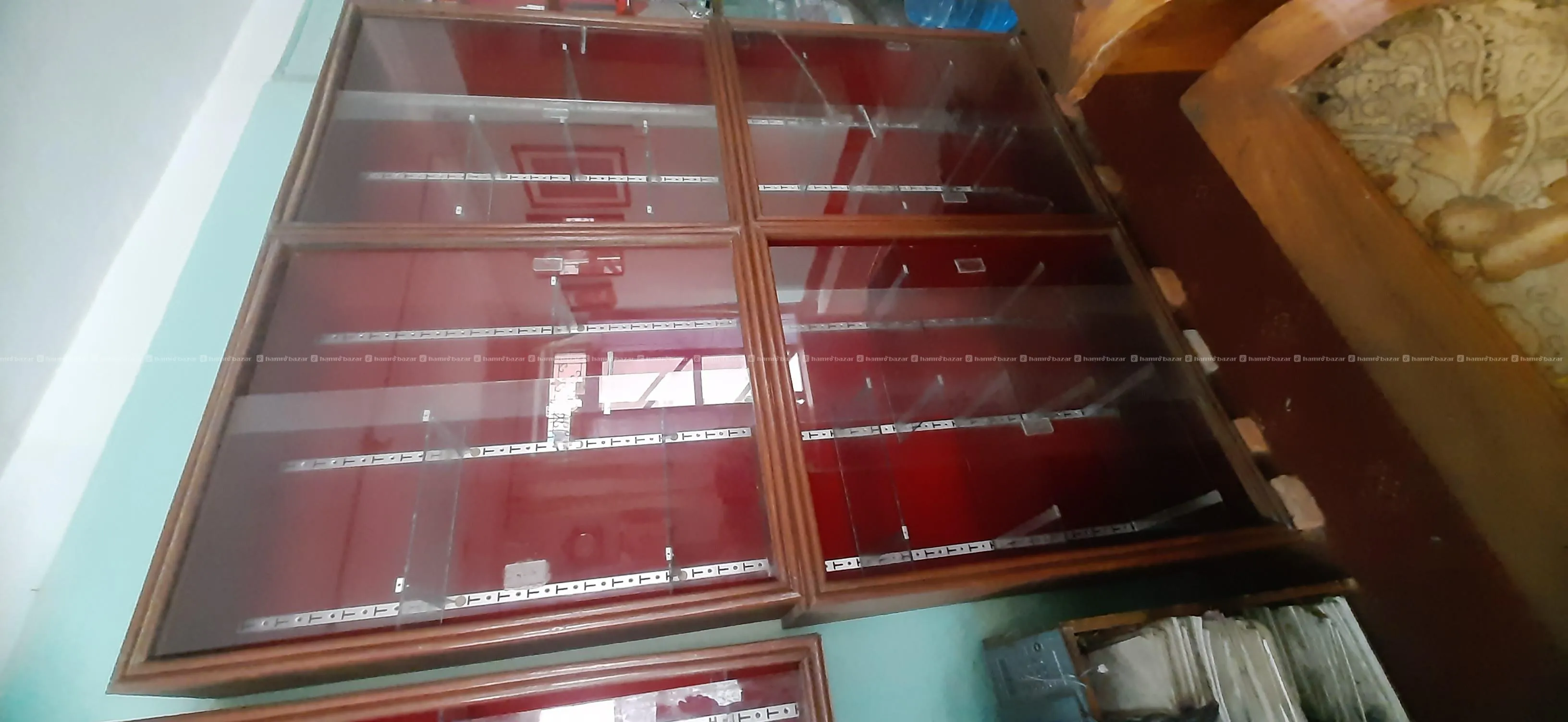 Showcase with glass panel in wooden almirah