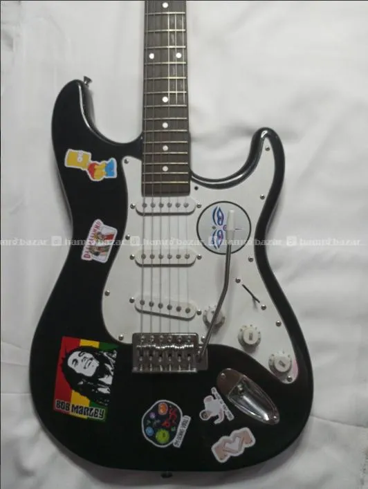 Electric guitar with its bag, amp and strap 2